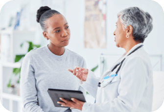 Doctor speaking with patient. Actor portrayal.