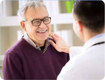 Patient smiling at doctor. Actor portrayal.